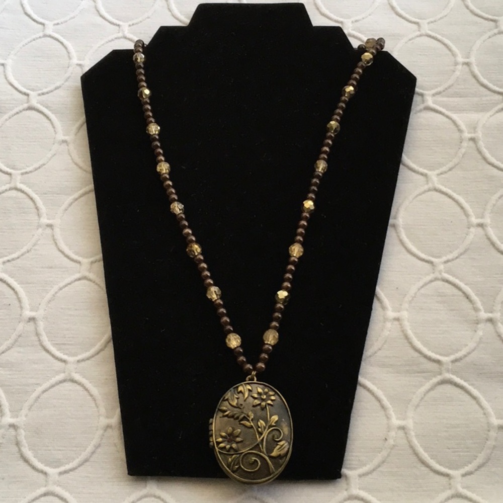 Brown beaded necklace with beautiful locket. NWOT